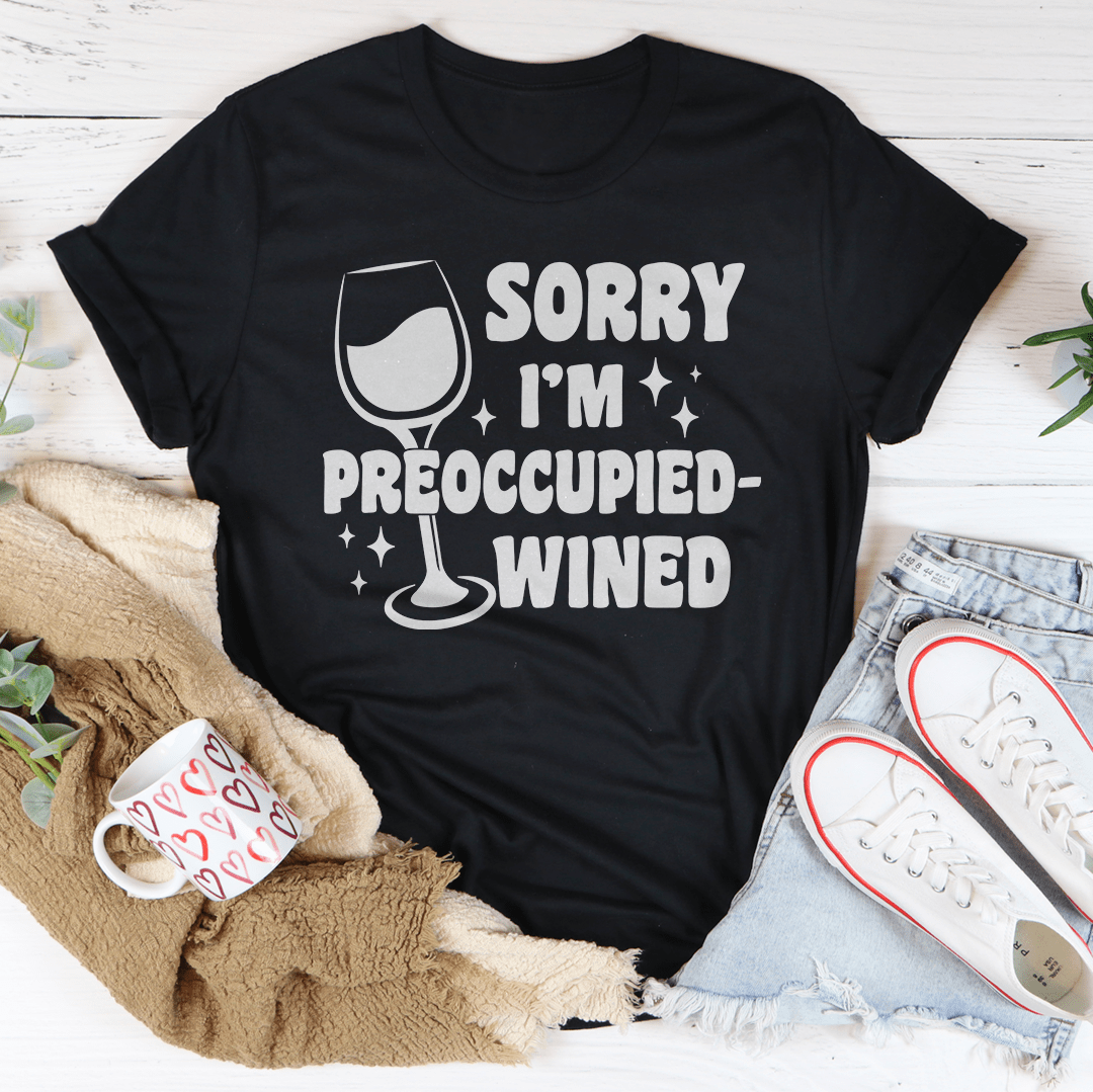 A stylish wined t-shirt with the text 'Sorry I’m Preoccupied' printed on it, showcasing its soft fabric and durable stitching.