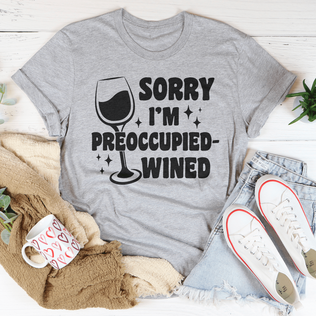 A stylish wined t-shirt with the text 'Sorry I’m Preoccupied' printed on it, showcasing its soft fabric and durable stitching.