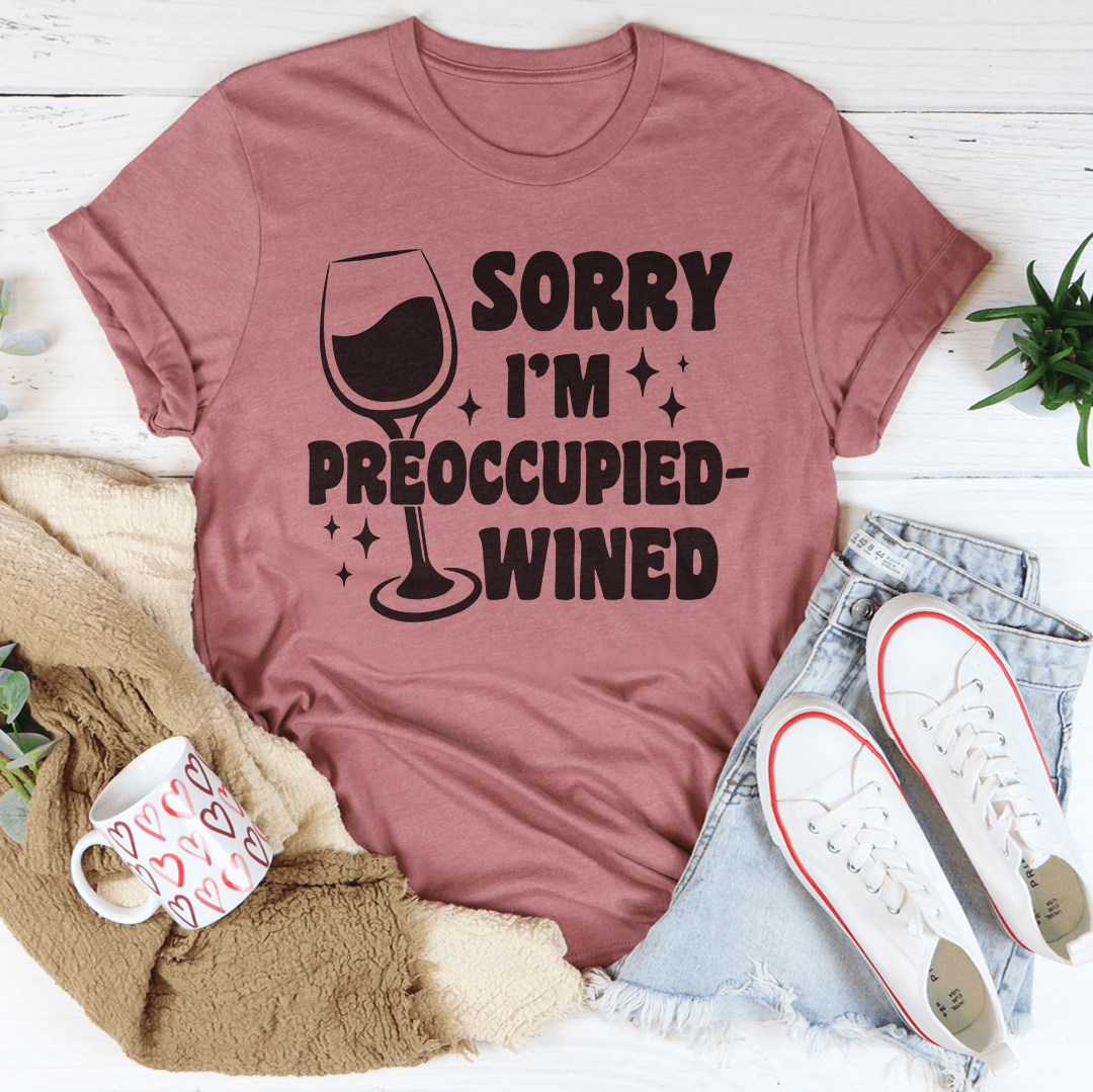 A stylish wined t-shirt with the text 'Sorry I’m Preoccupied' printed on it, showcasing its soft fabric and durable stitching.