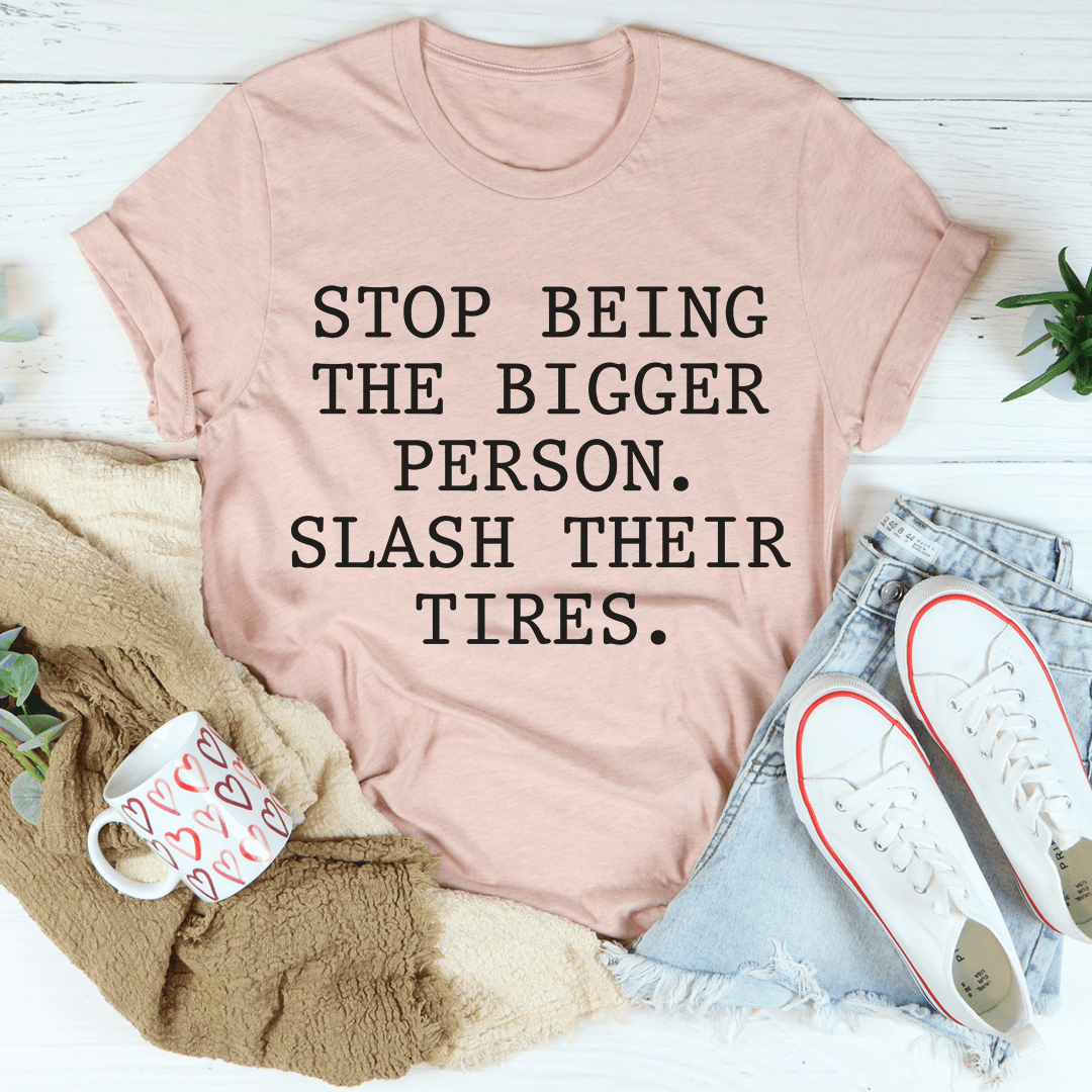 A stylish Stop Being The Bigger Person Tee made from soft ring-spun cotton, featuring double stitching for durability.