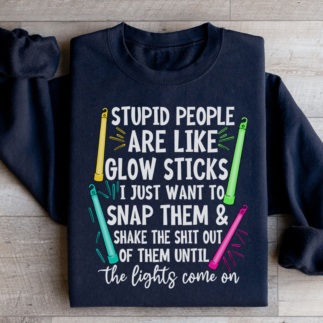 A cozy hoodie featuring the phrase 'Stupid People Are Like Glowsticks', made from a soft cotton/poly fleece blend.