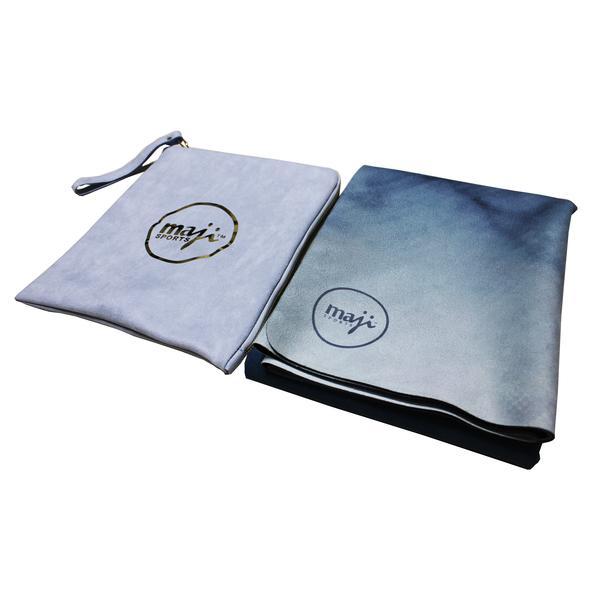 A beautifully printed travel yoga mat featuring a soft microfiber suede top and a natural rubber bottom, designed for optimal grip and comfort.