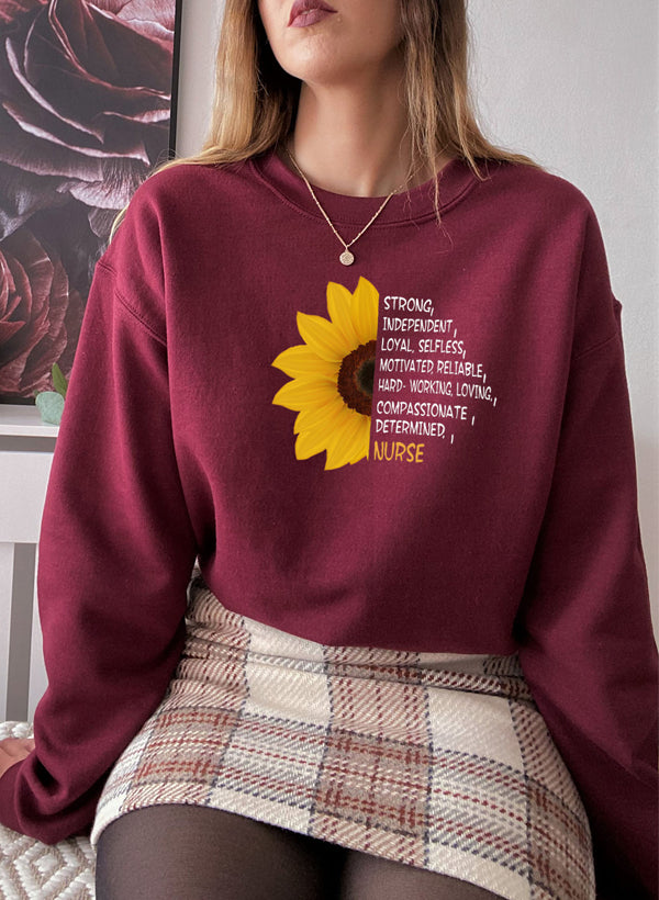 A cozy Sunflower Nurse Sweat Shirt featuring a vibrant sunflower design, perfect for nurses and casual wear.