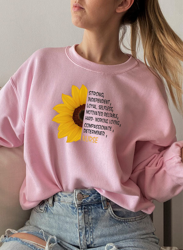 A cozy Sunflower Nurse Sweat Shirt featuring a vibrant sunflower design, perfect for nurses and casual wear.