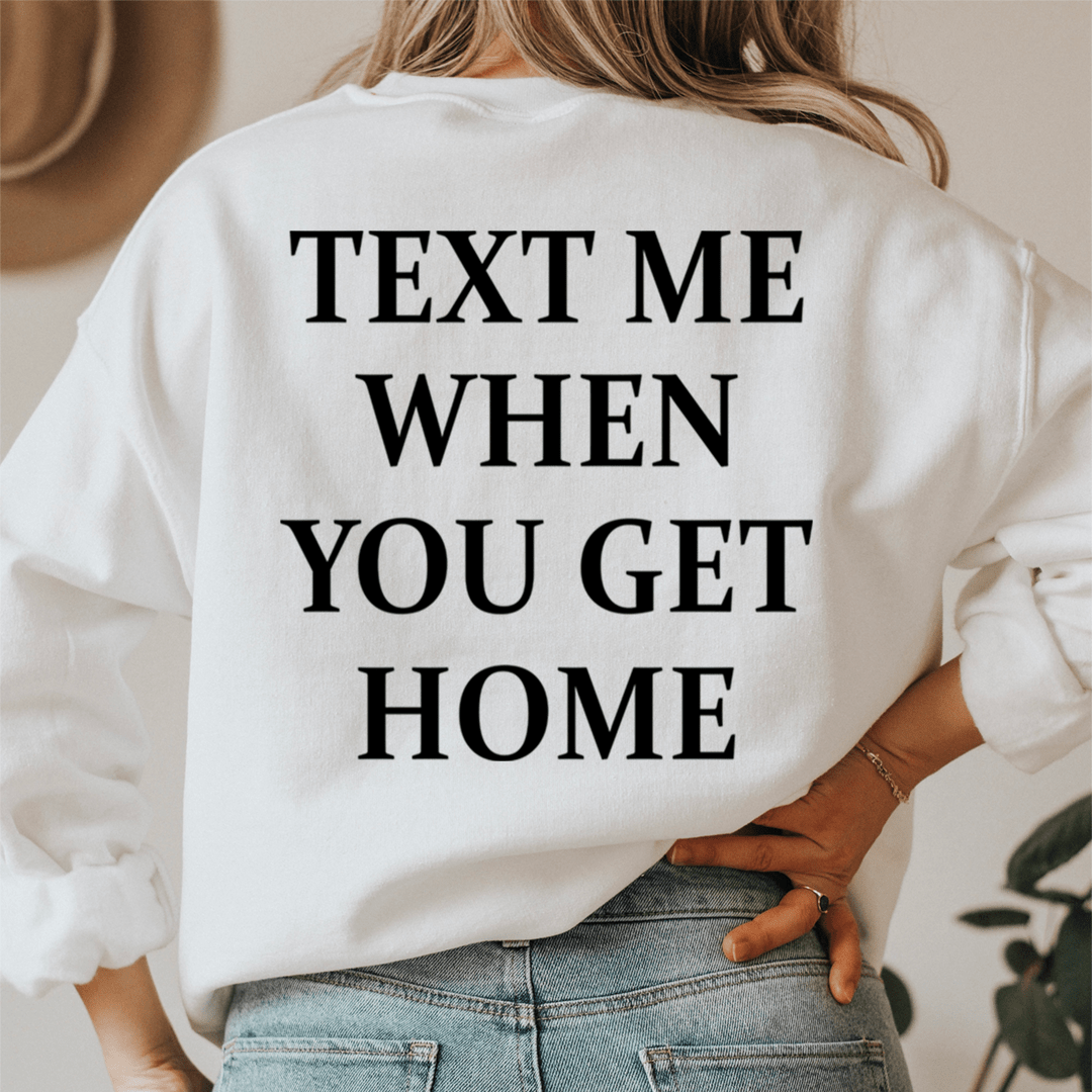 A cozy 'Text Me When You Get Home' hoodie featuring a unique design by top artists, made from a soft cotton/poly fleece blend.