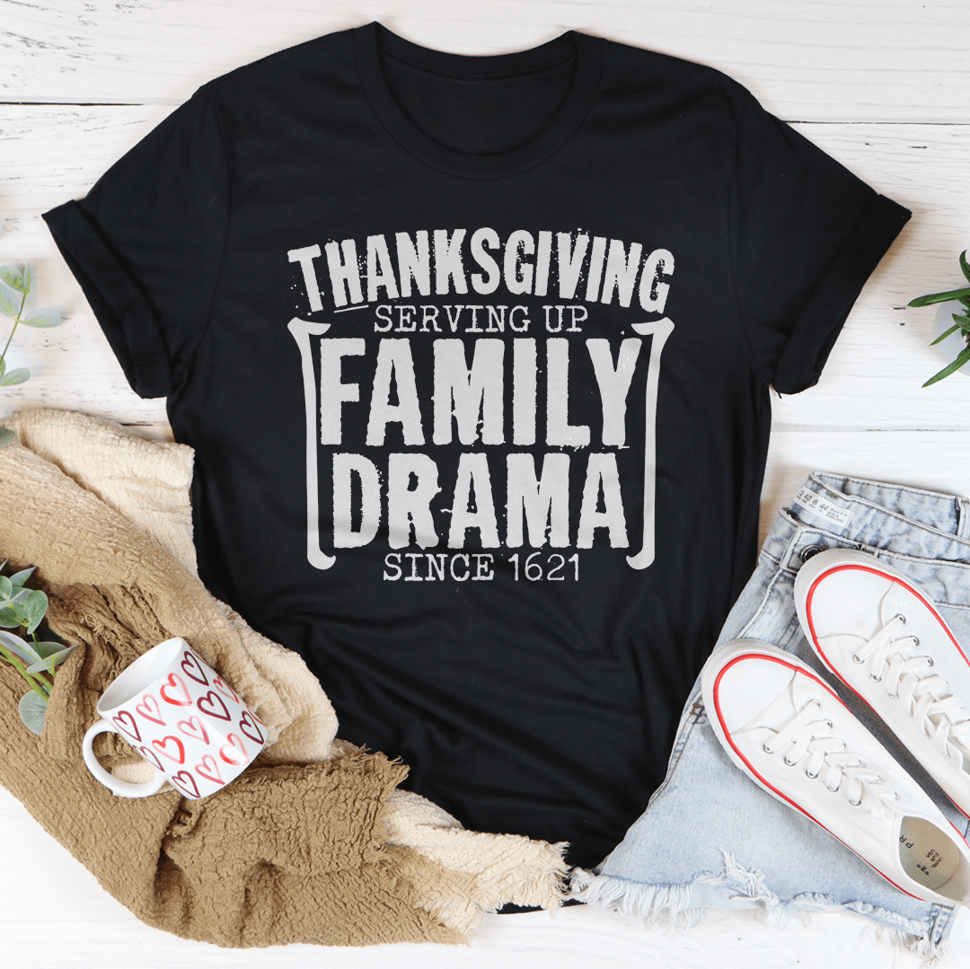 Thanksgiving Serving Up Drama Since 1621 T-Shirt featuring a playful design on soft cotton fabric, perfect for holiday celebrations.