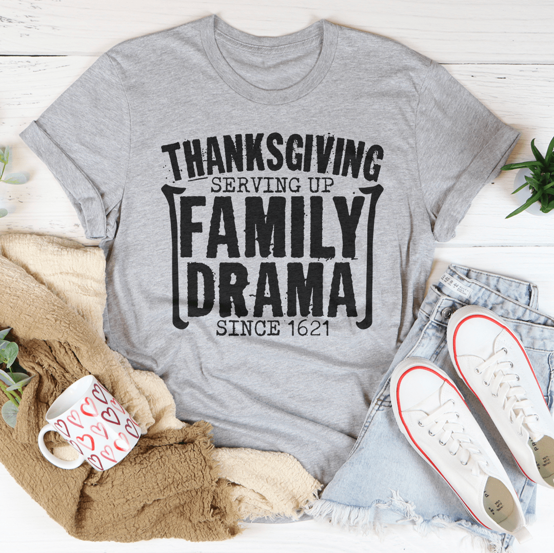 Thanksgiving Serving Up Drama Since 1621 T-Shirt featuring a playful design on soft cotton fabric, perfect for holiday celebrations.