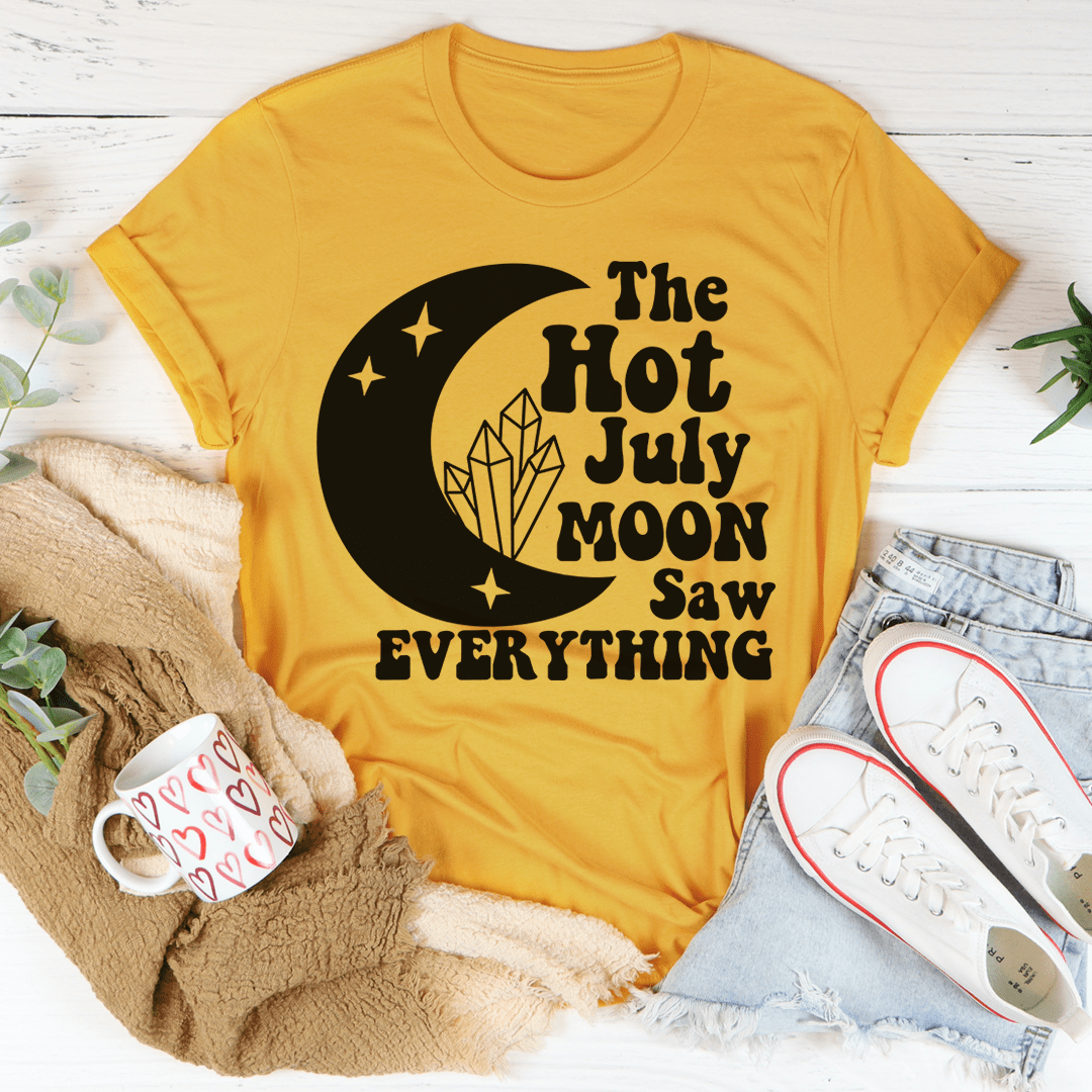 The Hot July Moon Saw Everything Tee, a soft and durable t-shirt made from ring-spun cotton, featuring double-stitched neckline and sleeves.