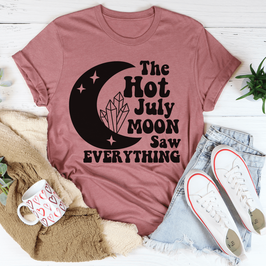 The Hot July Moon Saw Everything Tee, a soft and durable t-shirt made from ring-spun cotton, featuring double-stitched neckline and sleeves.