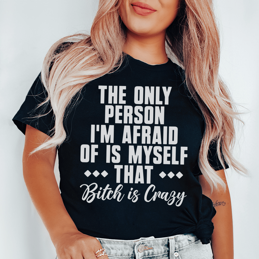 A stylish black t-shirt featuring the phrase 'The Only Person I'm Afraid Of Is Myself' printed in bold letters.