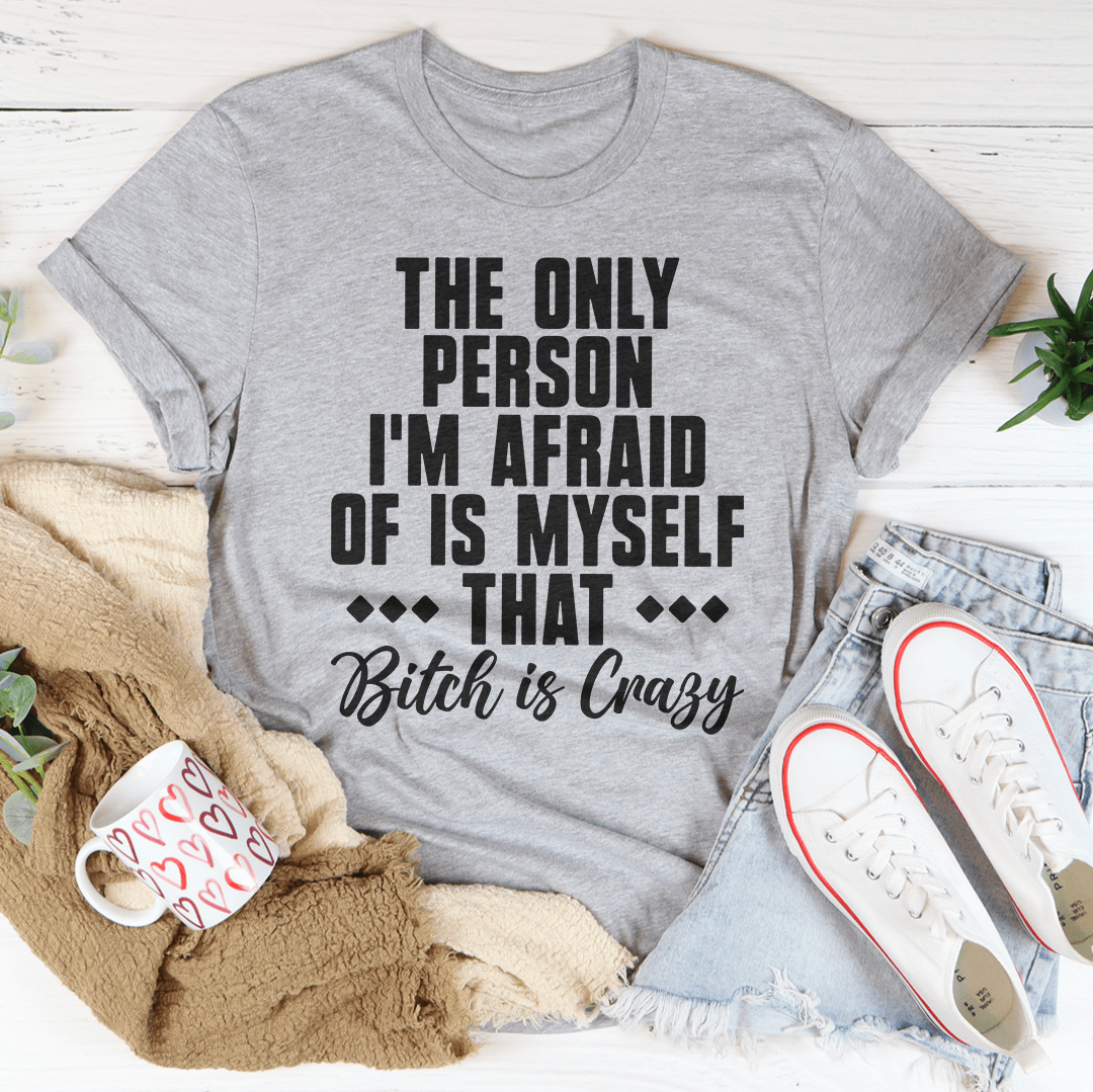 A stylish black t-shirt featuring the phrase 'The Only Person I'm Afraid Of Is Myself' printed in bold letters.