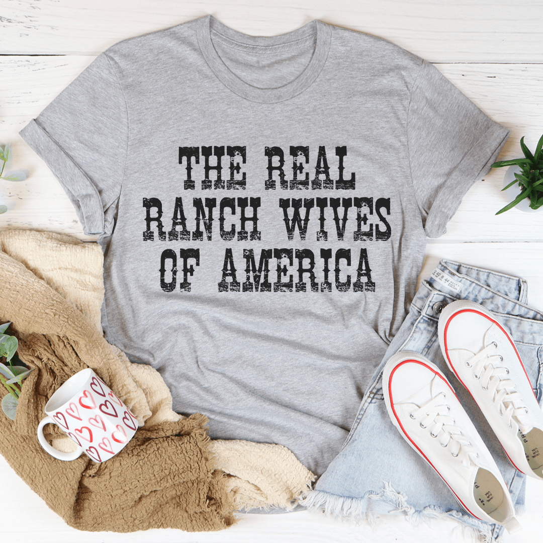 The Real Ranch Wives Of America T-Shirt displayed on a mannequin, showcasing its soft cotton fabric and durable stitching.