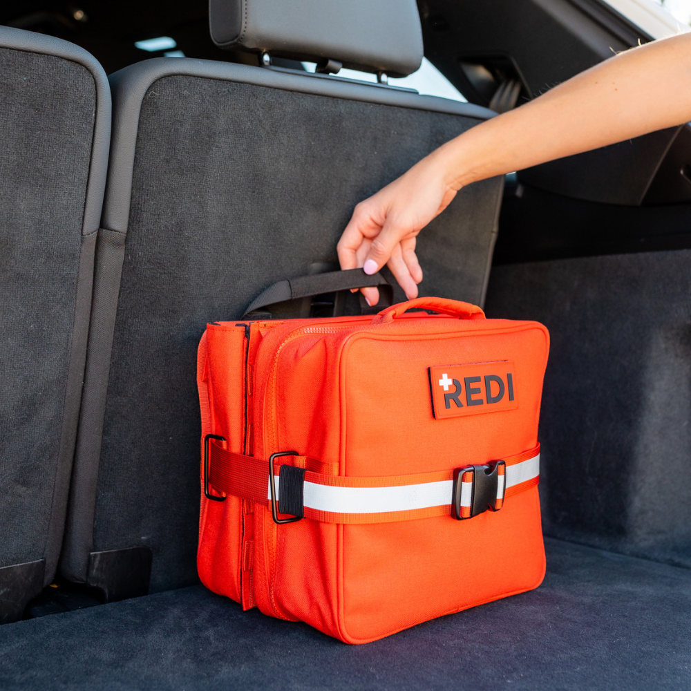 The Roadie + featuring a quick-release trauma pack, designed for emergency preparedness with essential life-saving items.