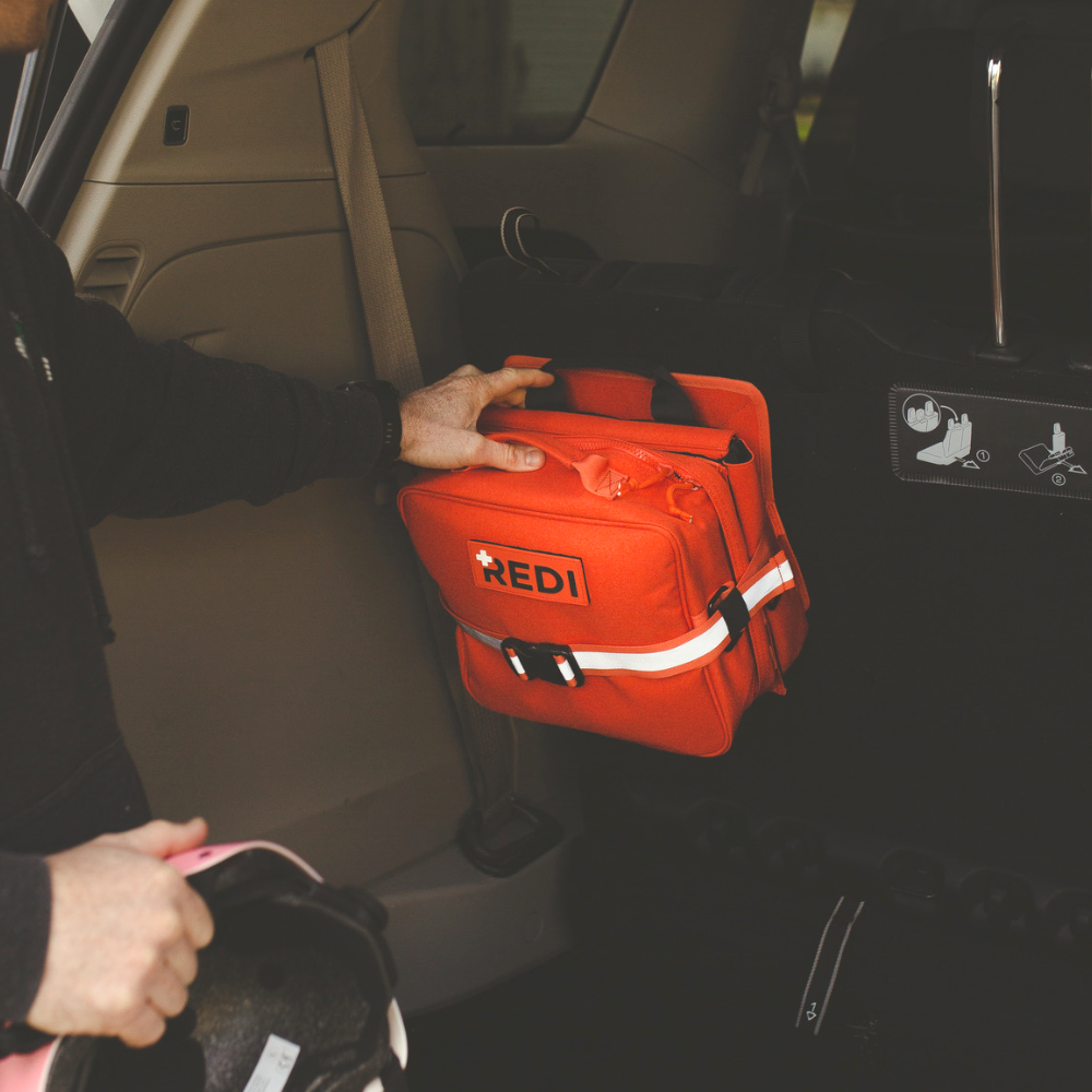 The Roadie + featuring a quick-release trauma pack, designed for emergency preparedness with essential life-saving items.