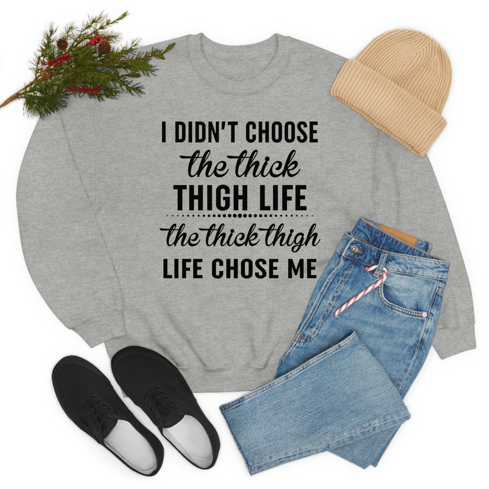 The Thick Thigh Life t-shirt in various colors, showcasing its soft cotton fabric and durable double stitching.