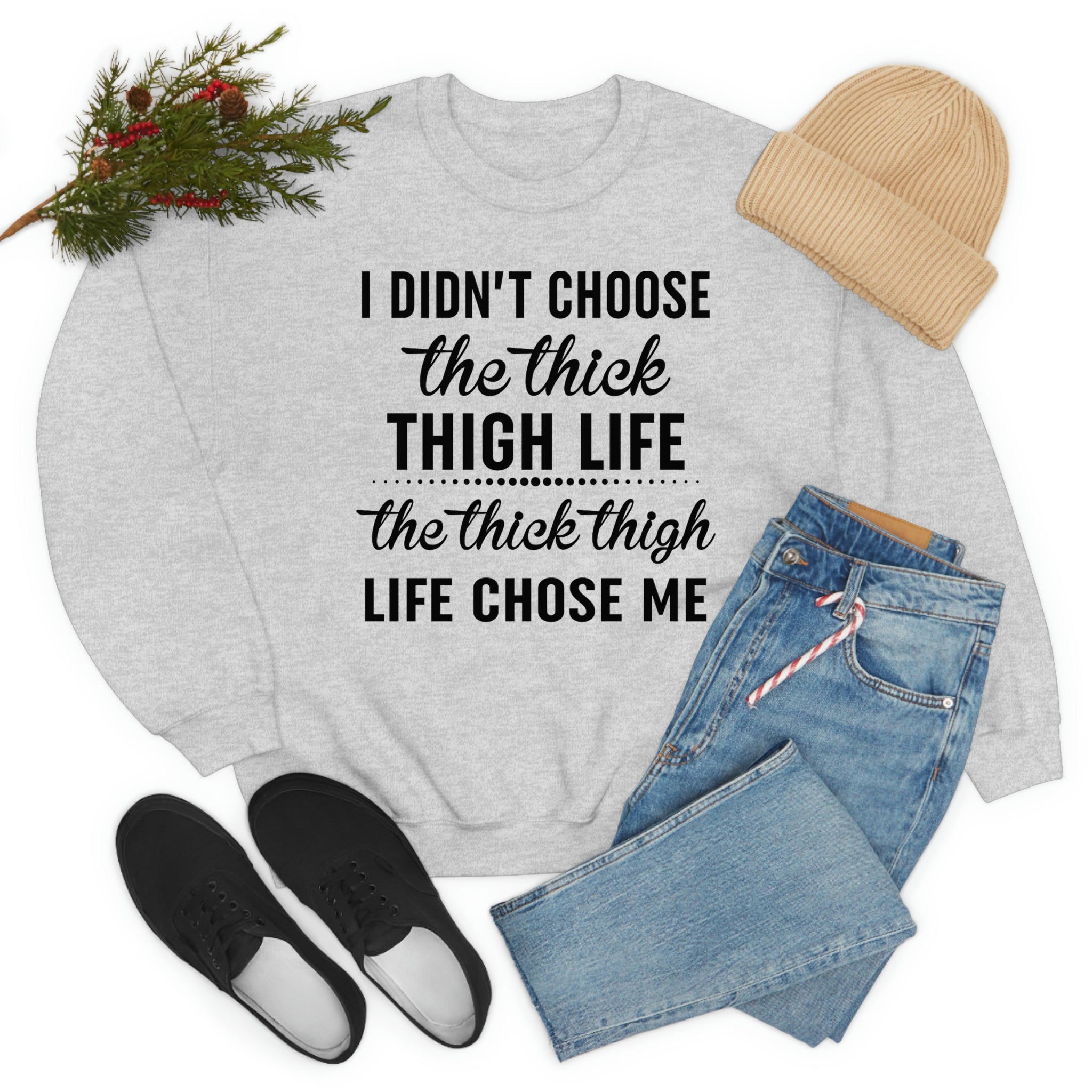 The Thick Thigh Life t-shirt in various colors, showcasing its soft cotton fabric and durable double stitching.