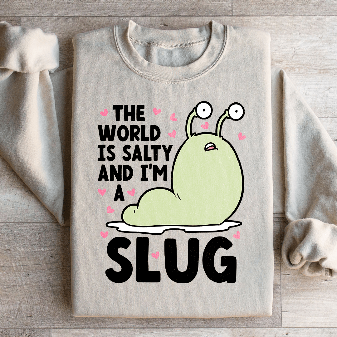 A cozy hoodie featuring the design 'The World Is Salty And I'm A Slug', made from a cotton/poly fleece blend with adjustable cuffs.