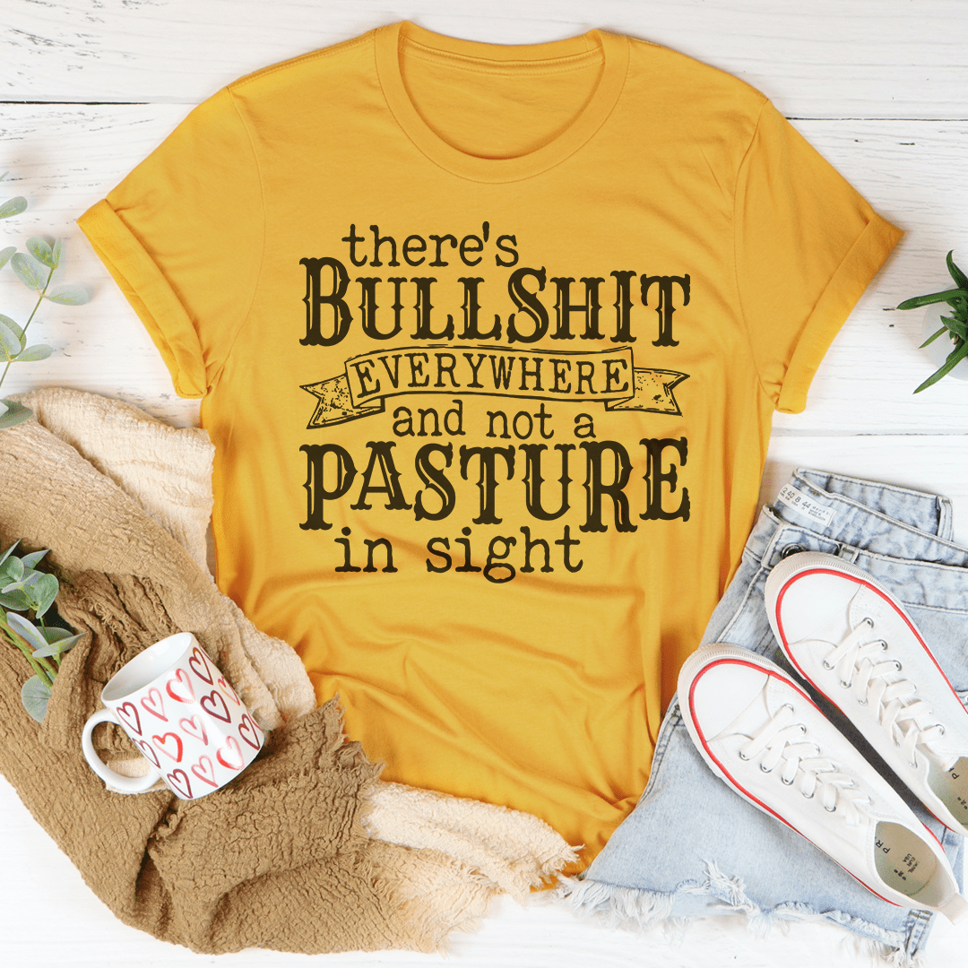 A comfortable and durable t-shirt featuring the phrase 'There's BS Everywhere And Not A Pasture In Sight' printed on it.