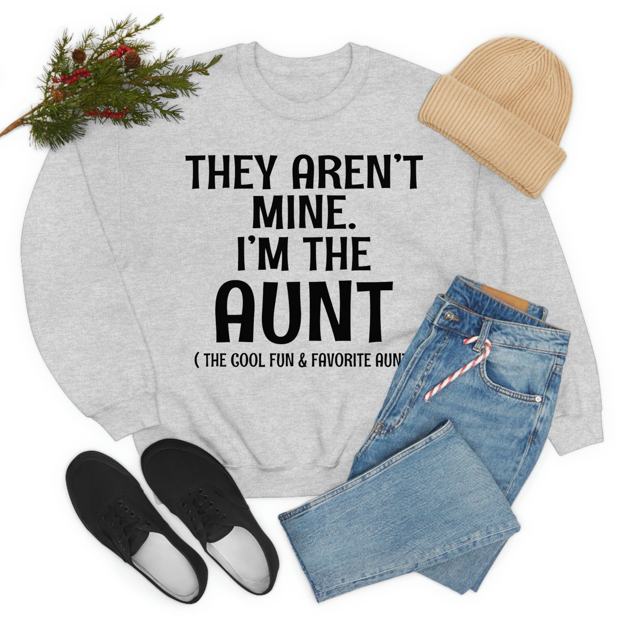 A soft, comfortable t-shirt featuring the phrase 'They Aren't Mine I'm The Aunt' in vibrant print, perfect for proud aunts.