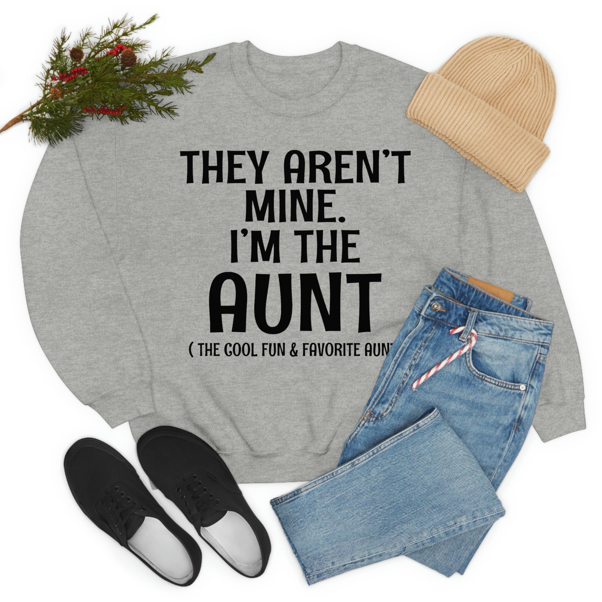 A soft, comfortable t-shirt featuring the phrase 'They Aren't Mine I'm The Aunt' in vibrant print, perfect for proud aunts.