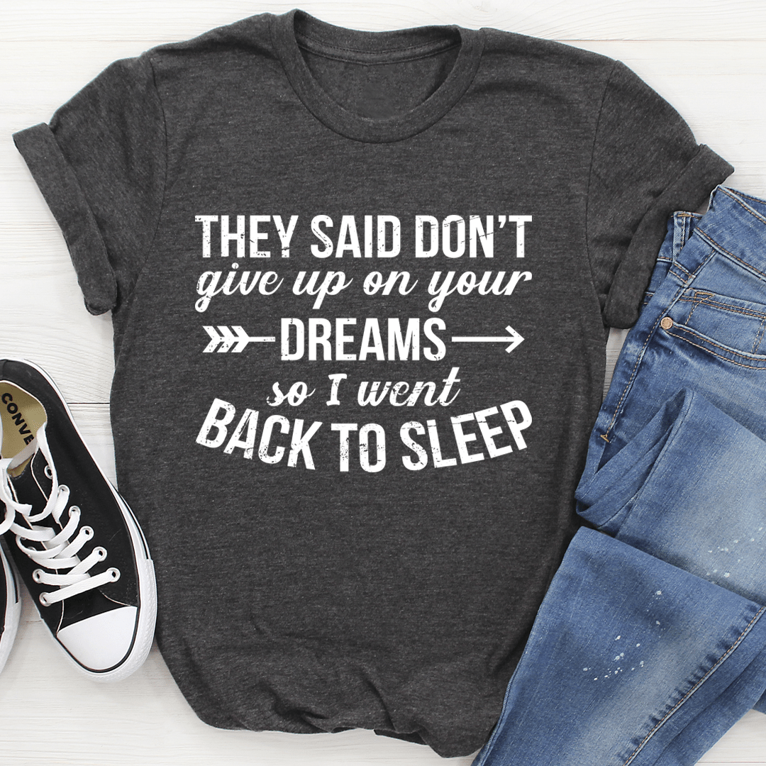 A stylish t-shirt featuring the motivational phrase 'They Said Don't Give Up On Your Dreams' printed on soft ring-spun cotton fabric.