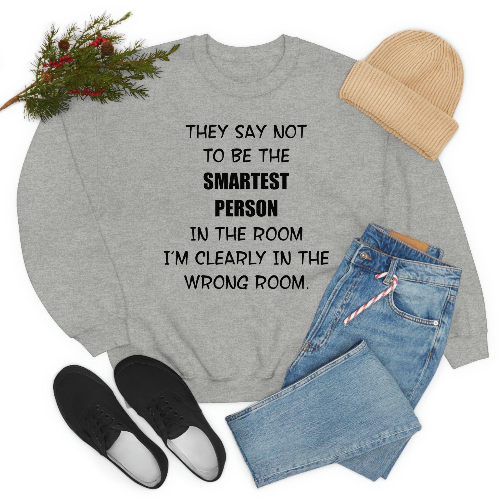 A stylish t-shirt featuring the phrase 'They Say Not To Be The Smartest Person In The Room', made from soft ring-spun cotton with double stitching.