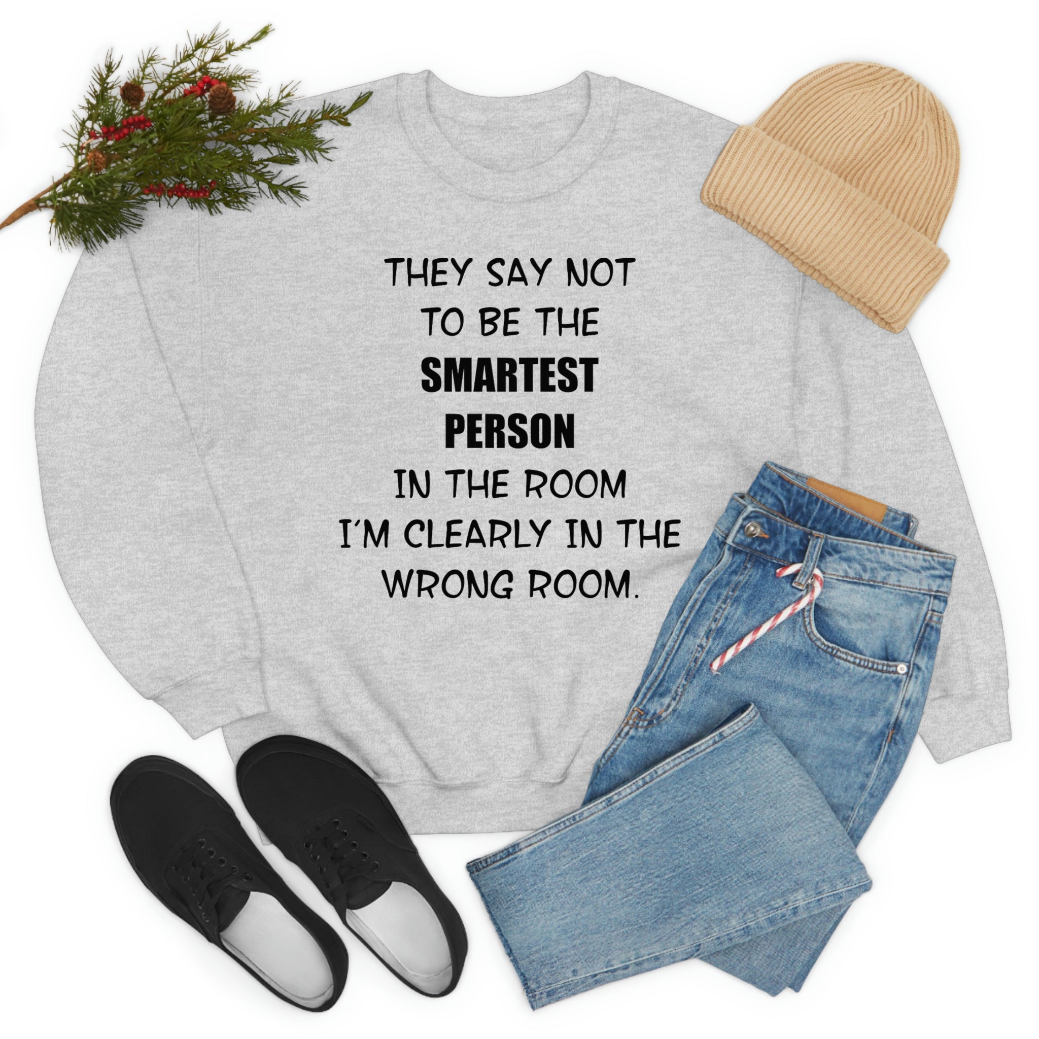 A stylish t-shirt featuring the phrase 'They Say Not To Be The Smartest Person In The Room', made from soft ring-spun cotton with double stitching.