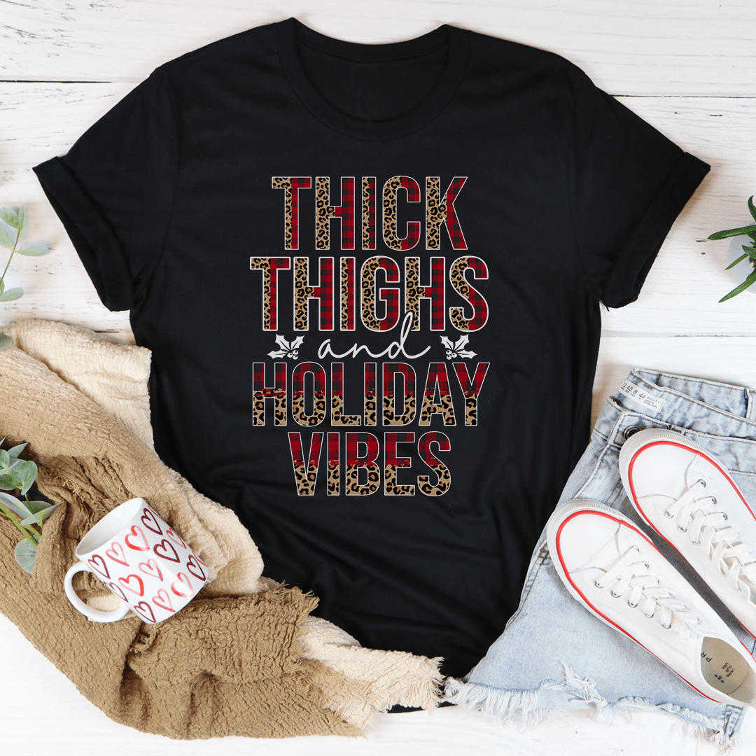 Thick Thighs And Holiday Vibes T-Shirt displayed on a mannequin, showcasing its soft cotton fabric and playful design.