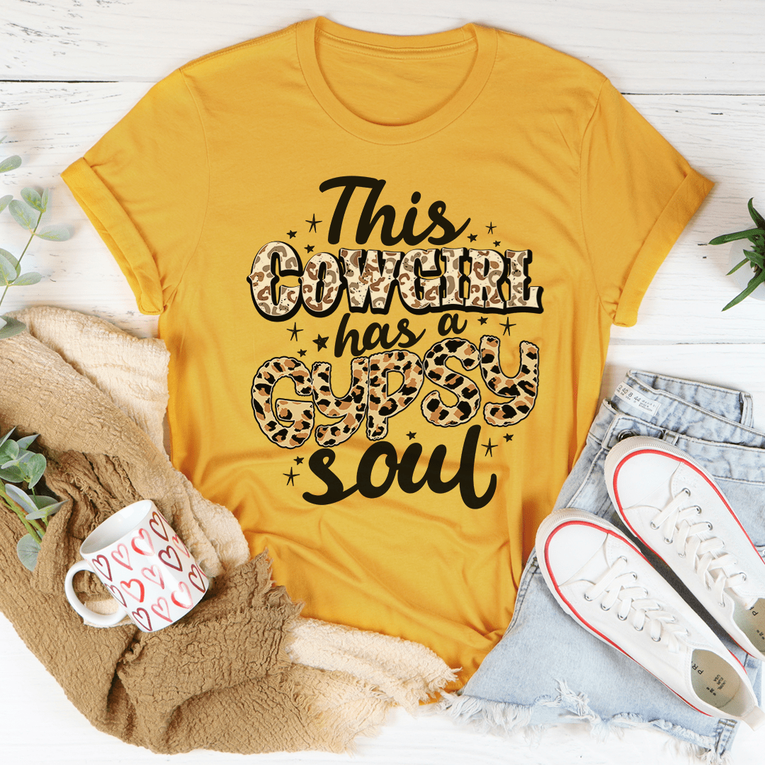 A stylish t-shirt featuring the phrase 'This Cowgirl Has A Gypsy Soul', made from soft cotton with a durable design.