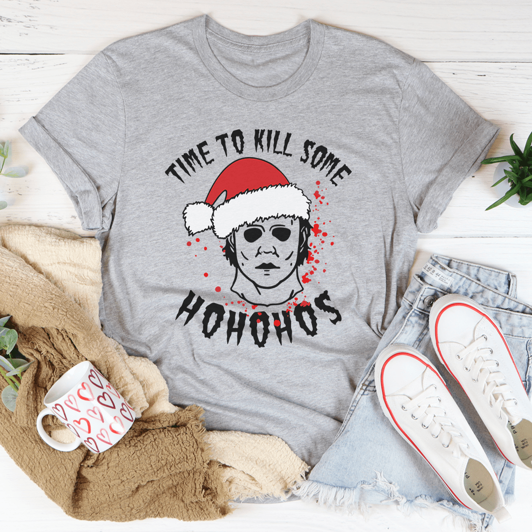 A festive t-shirt featuring the phrase 'Time To Kill Some Ho Ho Hos' printed in a fun design, made from soft ring-spun cotton.