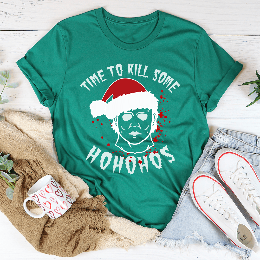 A festive t-shirt featuring the phrase 'Time To Kill Some Ho Ho Hos' printed in a fun design, made from soft ring-spun cotton.