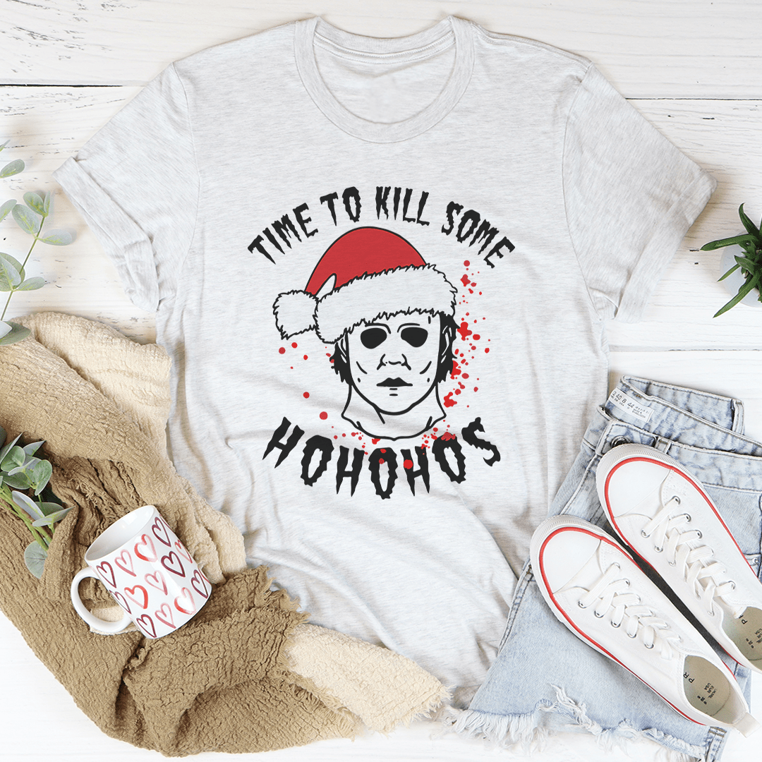 A festive t-shirt featuring the phrase 'Time To Kill Some Ho Ho Hos' printed in a fun design, made from soft ring-spun cotton.