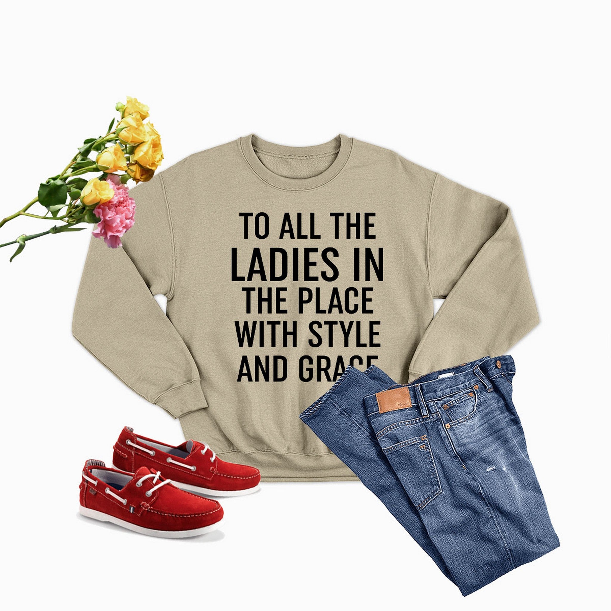 A stylish sweatshirt with the phrase 'To All The Ladies In The Place With Style And Grace' printed on it, showcasing its soft fabric and durable stitching.