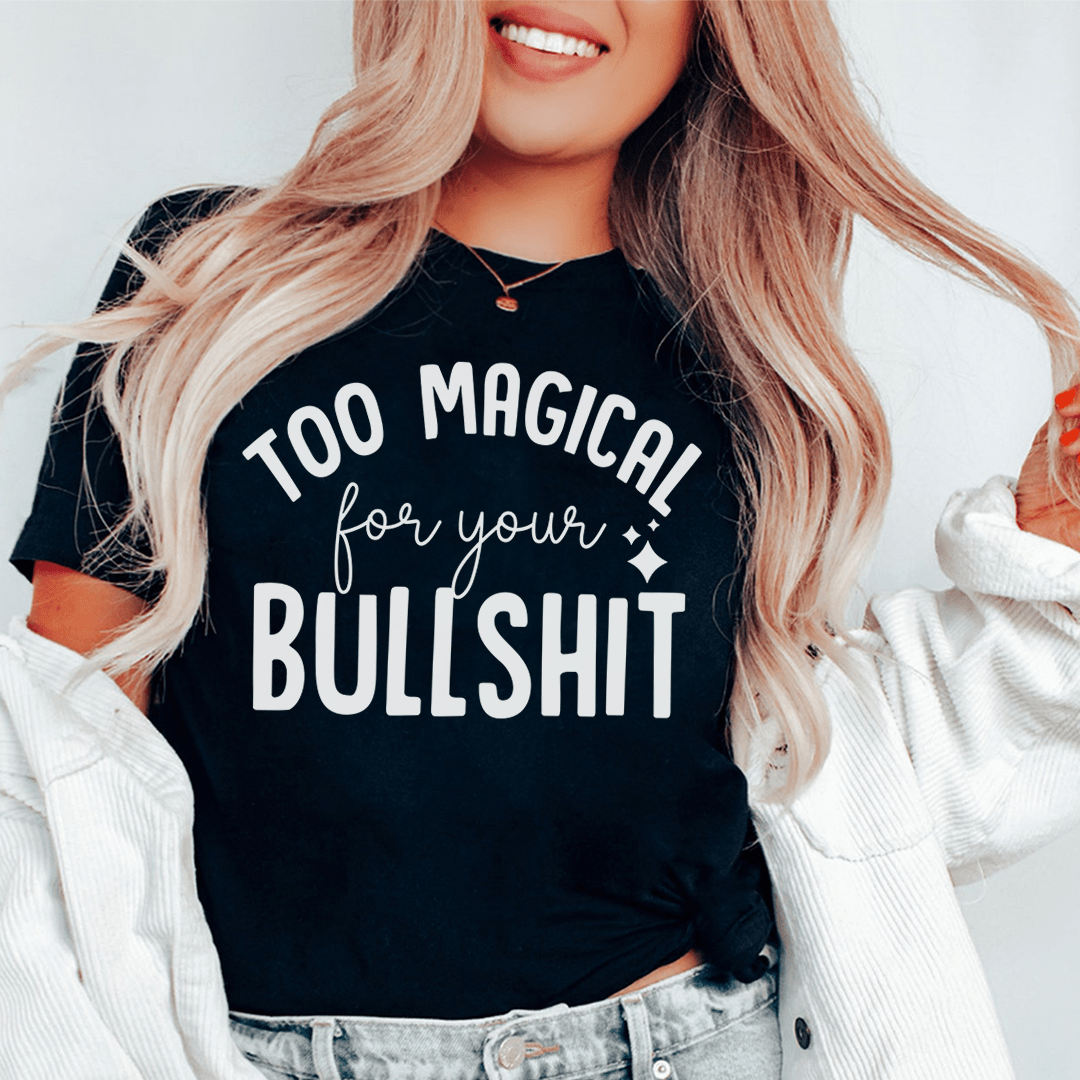 A stylish black t-shirt with the phrase 'Too Magical For Your Bullshit' printed in bold white letters, showcasing its soft fabric and durable stitching.