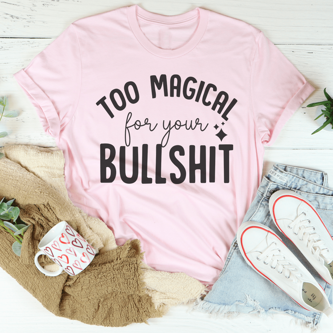 A stylish black t-shirt with the phrase 'Too Magical For Your Bullshit' printed in bold white letters, showcasing its soft fabric and durable stitching.