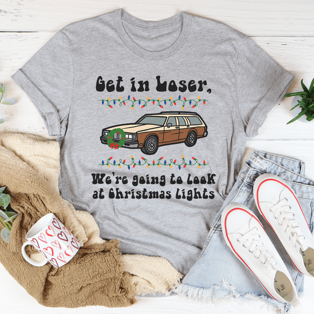 A festive t-shirt featuring the phrase 'We're Going To Look At Christmas Lights', made from soft cotton with double stitching for durability.