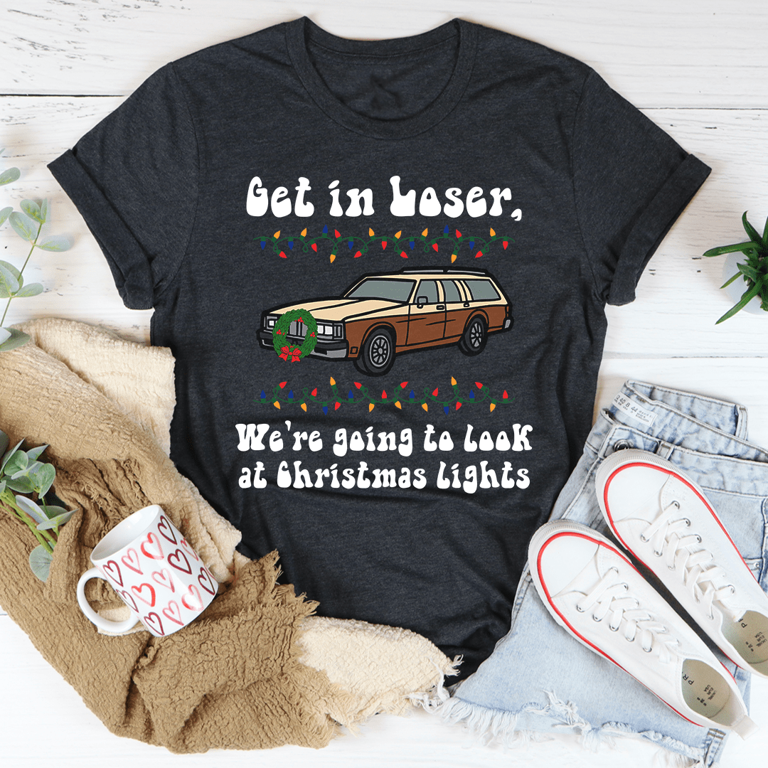 A festive t-shirt featuring the phrase 'We're Going To Look At Christmas Lights', made from soft cotton with double stitching for durability.