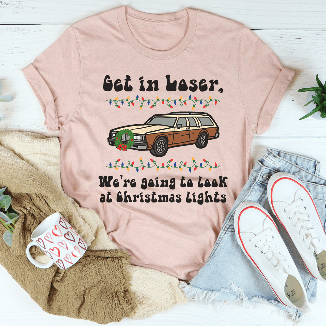 A festive t-shirt featuring the phrase 'We're Going To Look At Christmas Lights', made from soft cotton with double stitching for durability.