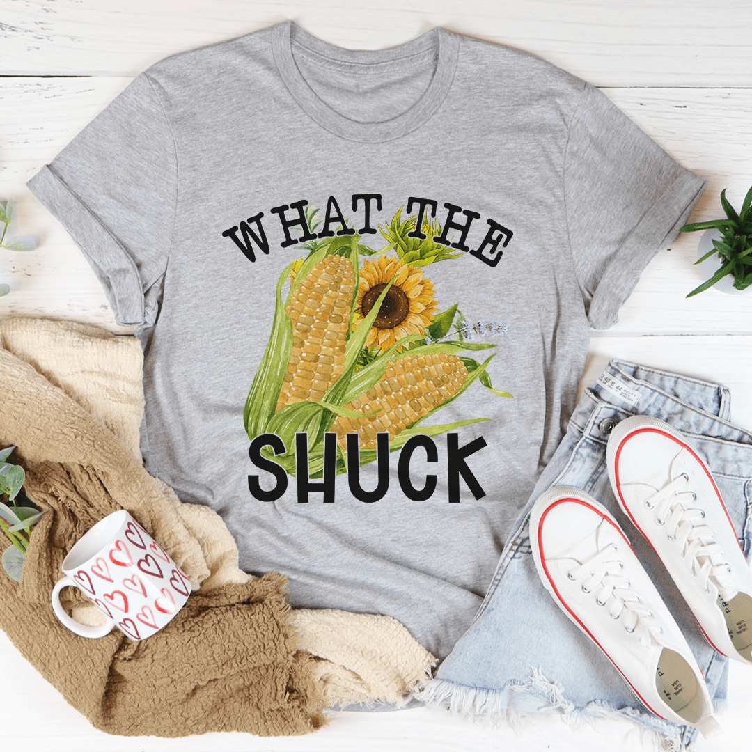 What The Shuck T-Shirt made of soft ring-spun cotton, featuring double stitching for durability, available in various sizes.