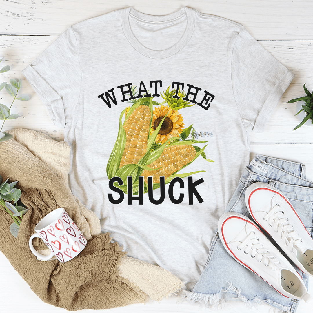 What The Shuck T-Shirt made of soft ring-spun cotton, featuring double stitching for durability, available in various sizes.