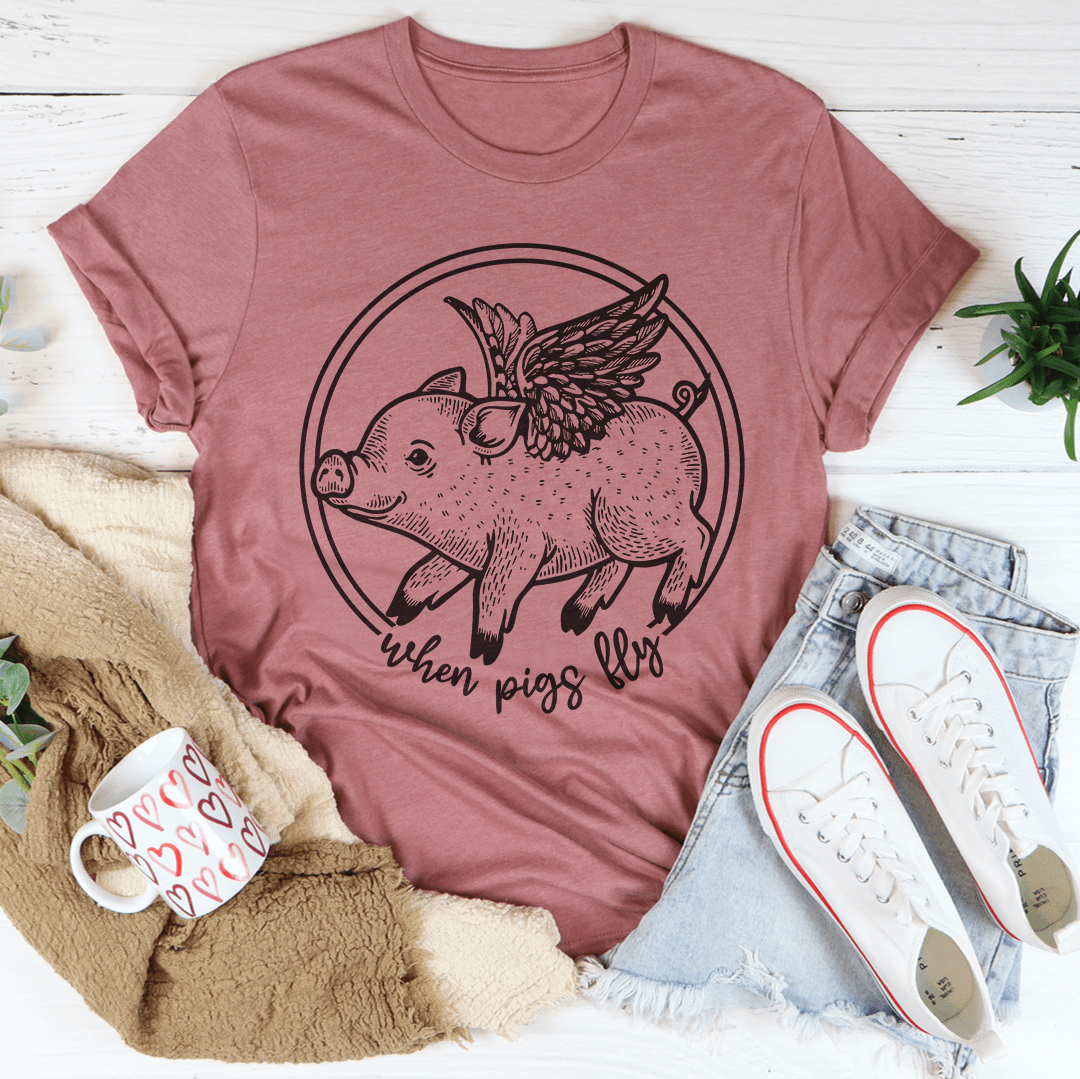 A comfortable When Pigs Fly Tee made of soft ring-spun cotton, featuring double stitching for durability, available in various colors.