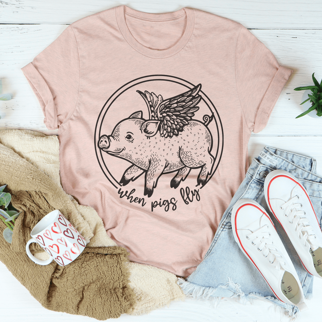 A comfortable When Pigs Fly Tee made of soft ring-spun cotton, featuring double stitching for durability, available in various colors.