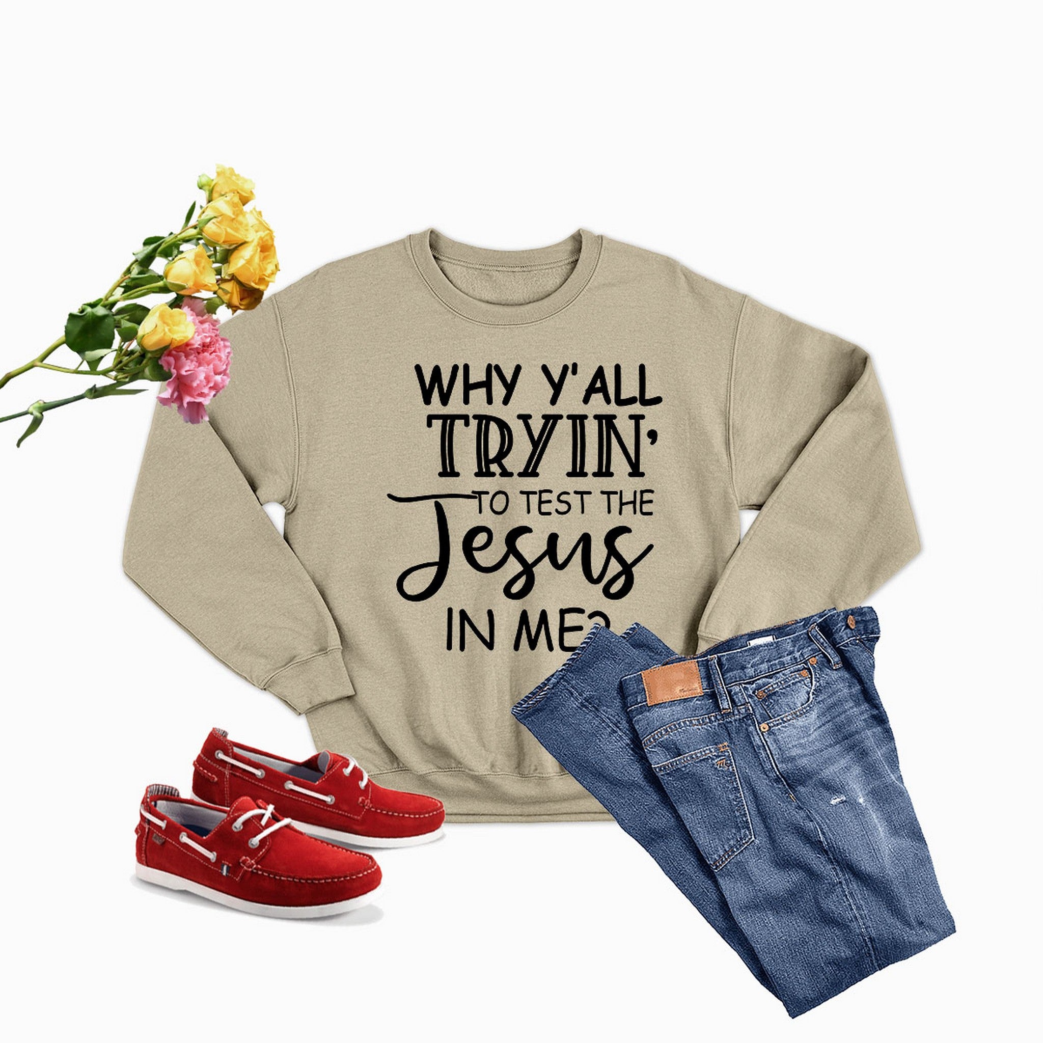 A cozy sweatshirt featuring the phrase 'Why Y'All Tryin To Test The Jesus In Me' in a stylish font, perfect for expressing faith.