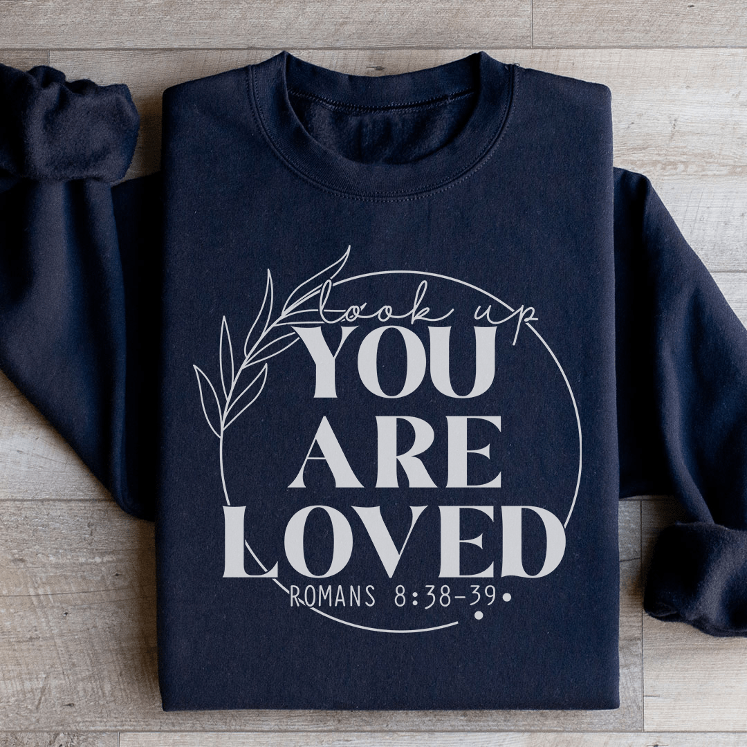 Cozy 'You Are Loved' sweats featuring a cotton/poly fleece blend, designed by top artists for ultimate comfort and style.