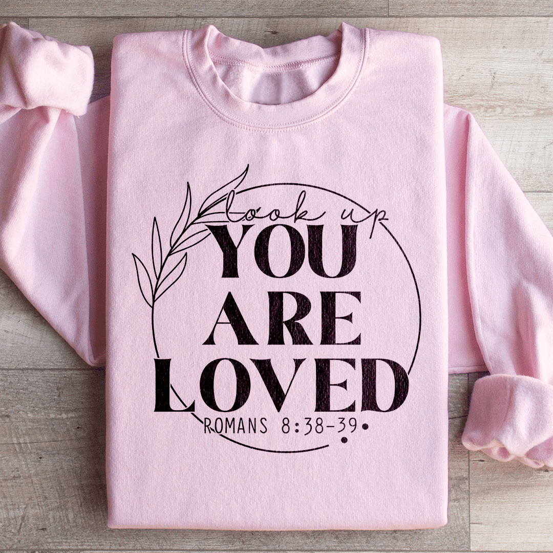 Cozy 'You Are Loved' sweats featuring a cotton/poly fleece blend, designed by top artists for ultimate comfort and style.