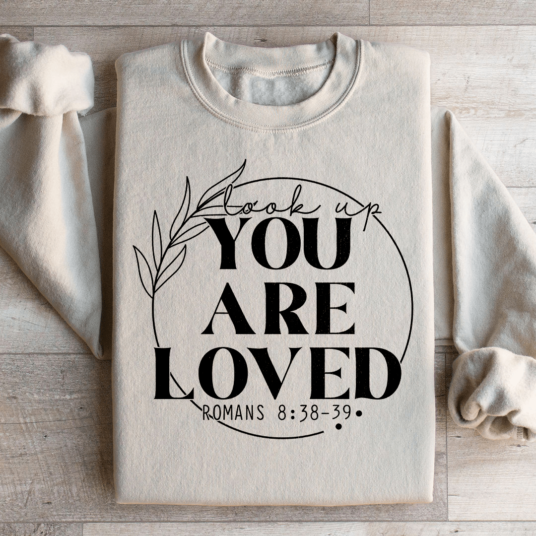 Cozy 'You Are Loved' sweats featuring a cotton/poly fleece blend, designed by top artists for ultimate comfort and style.