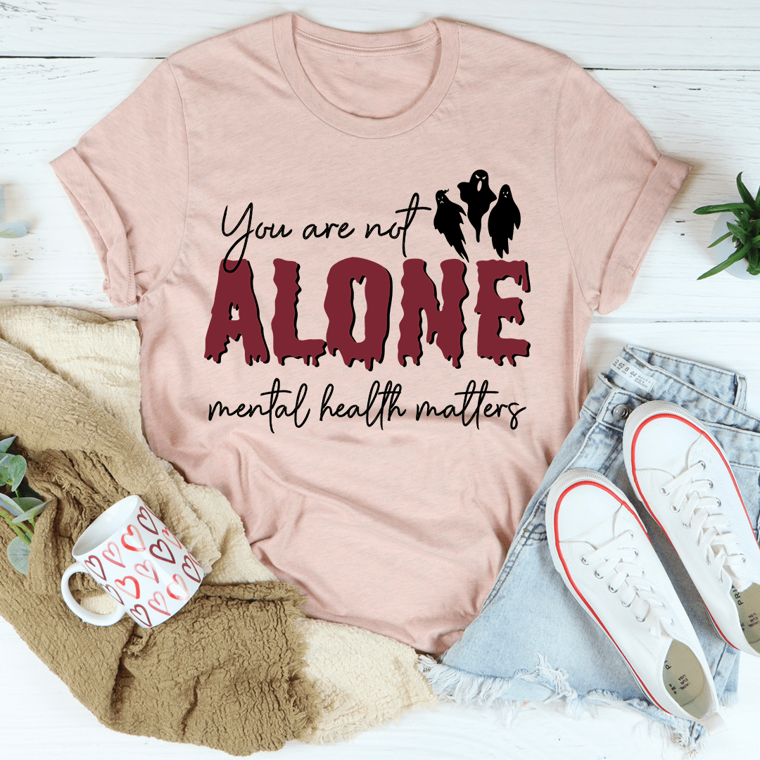 You Are Not Alone Mental Health Awareness Halloween Tee featuring a vibrant design on a soft cotton fabric.