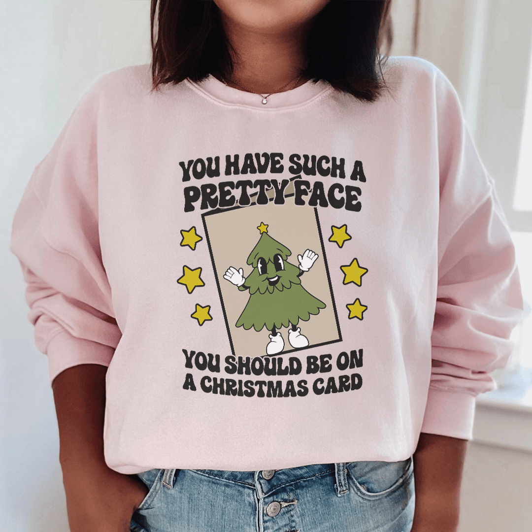 A stylish hoodie featuring the phrase 'You Have Such A Pretty Face', designed by top artists, showcasing a cozy fleece material.