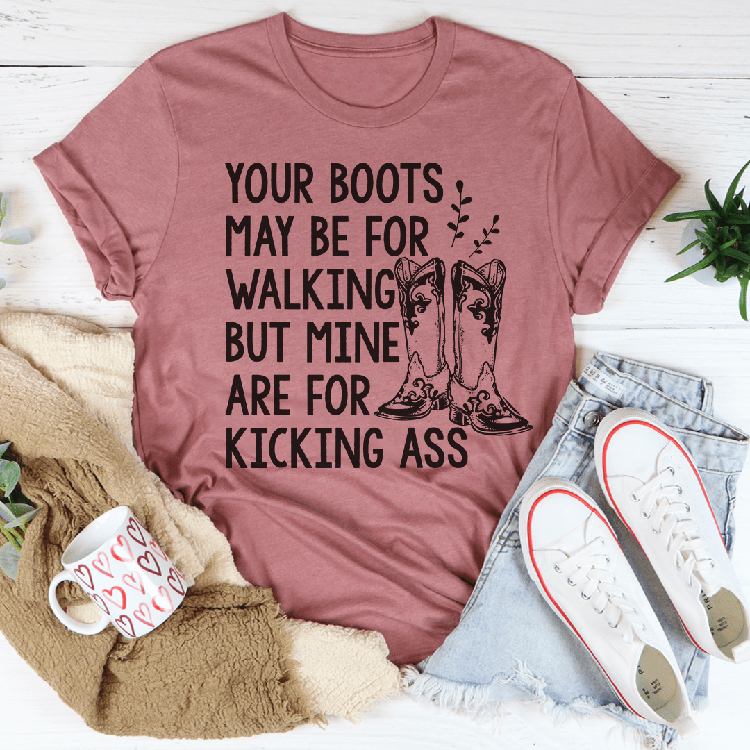 A comfortable and stylish 'Your Boots May Be For Walking' T-Shirt made from soft ring-spun cotton, featuring double stitching for durability.