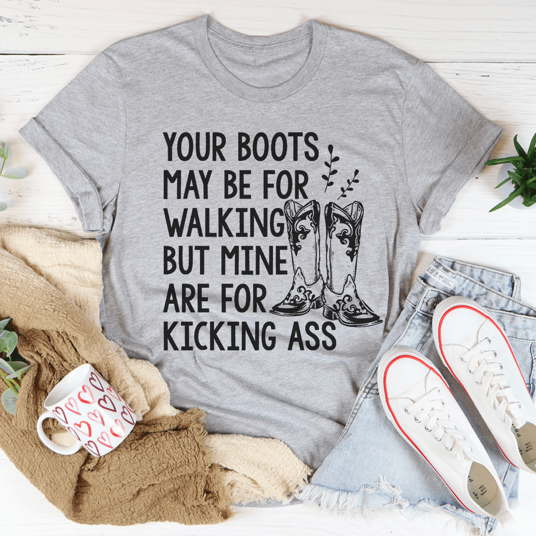 A comfortable and stylish 'Your Boots May Be For Walking' T-Shirt made from soft ring-spun cotton, featuring double stitching for durability.